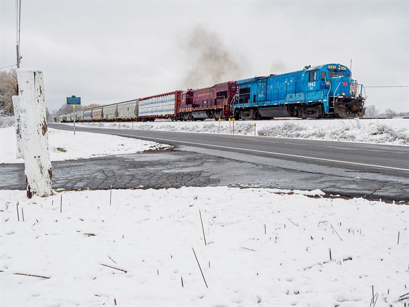 Finger Lakes Railway locomotive 1943 crossing a snowy highway